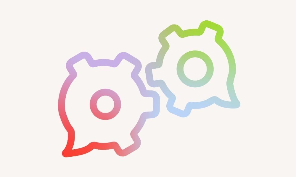 Zeigt zwei Sprechblasen, die sich berühren. An der Stelle sehen sie aus wie Zahnräder, die ineinander greifen.